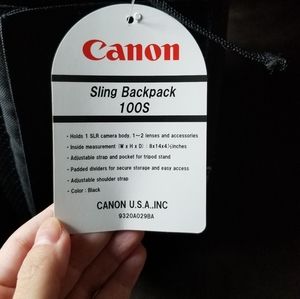 New with tags canon brand camera case over shoulder strap sling style.
